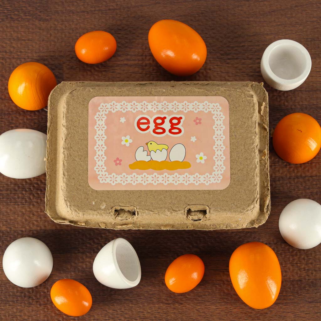 Oua de jucarie, Zola®, detasabile, cu galbenusuri din lemn, 6 buc si cutie depozitare, 15.5x10x6 cm Oua de jucarie, Zola®, detasabile, cu galbenusuri din lemn, 6 buc si cutie depozitare, 15.5x10x6 cm